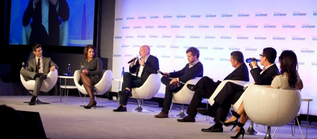 group of speakers at a conference